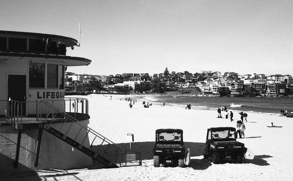 <strong>Buggies outside the lifeguard tower</strong><br> <!-- title -->
July 2024<br> <!-- date -->
Scanned BW negative<br> <!-- medium -->
Ilford FP4+ @ 200 ISO<br> <!-- film stock -->
Contax G1 + Zeiss Planar 45mm f/2 <!-- camera/lens -->
<br><br>
<em> <!-- inspiration/motivation -->
No description available yet.
</em>
