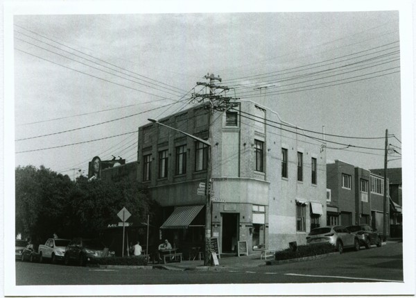 <strong>Trafalgar Street Espresso</strong><br> <!-- title -->
May 2024<br> <!-- date -->
5x7" BW Enlargement<br> <!-- medium -->
Ilford HP5+ @ 400 ISO<br> <!-- film stock -->
Yashica Electro 35 GSN <!-- camera/lens -->
<br><br>
<em> <!-- inspiration/motivation -->
The local coffee shop from when I lived in Annandale.
</em>
