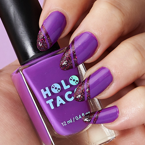 photo of hand with painted nails. the nails are purple with dark red glitter in a striped design at the tip. there is only a subtle white streak lengthwise along each nail, caused by the light bounced off the ceiling.